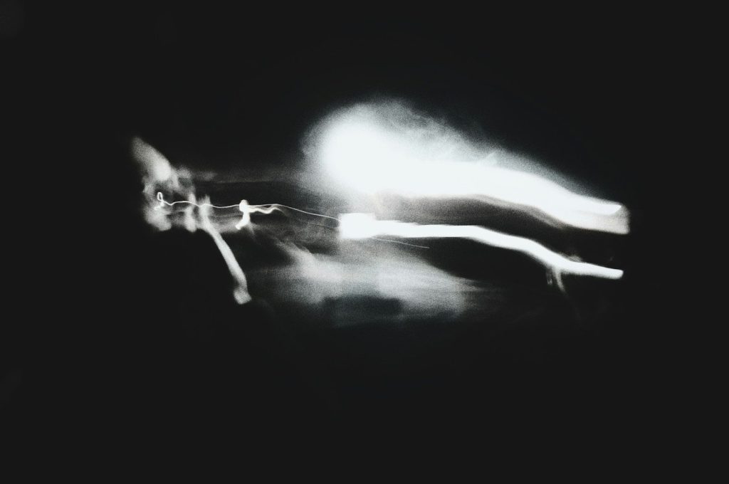 Abstract blurred light streaks on black background