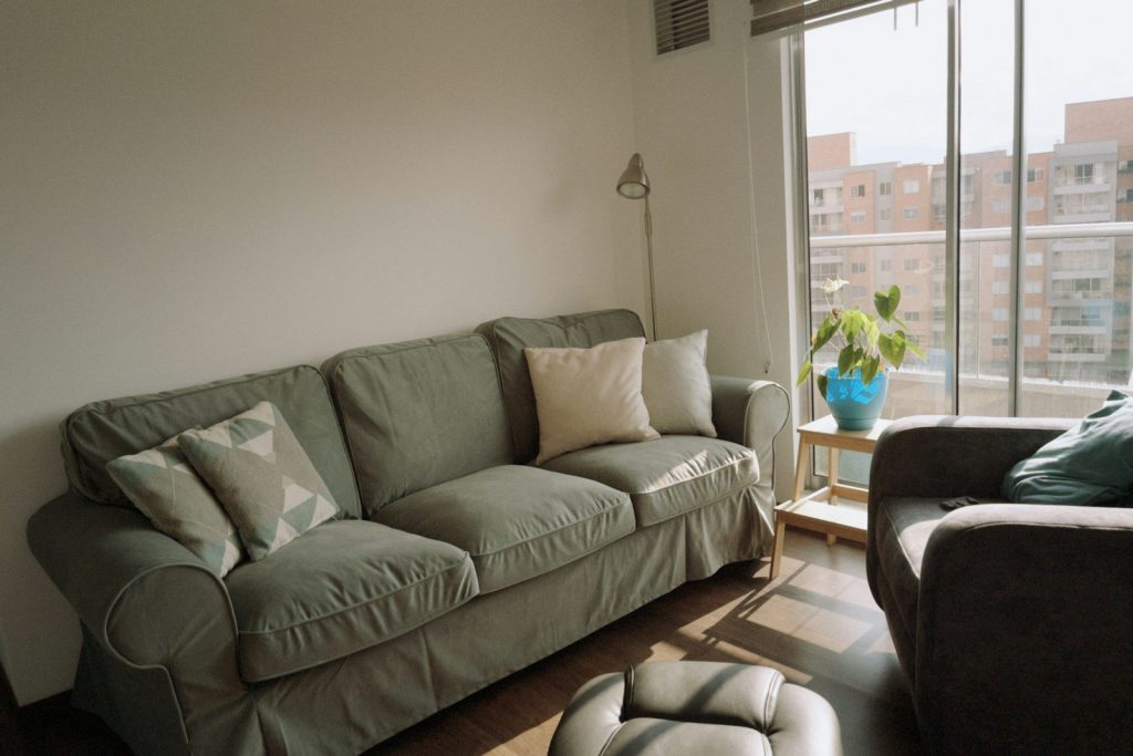 A comfortable living room with a sofa and armchair.