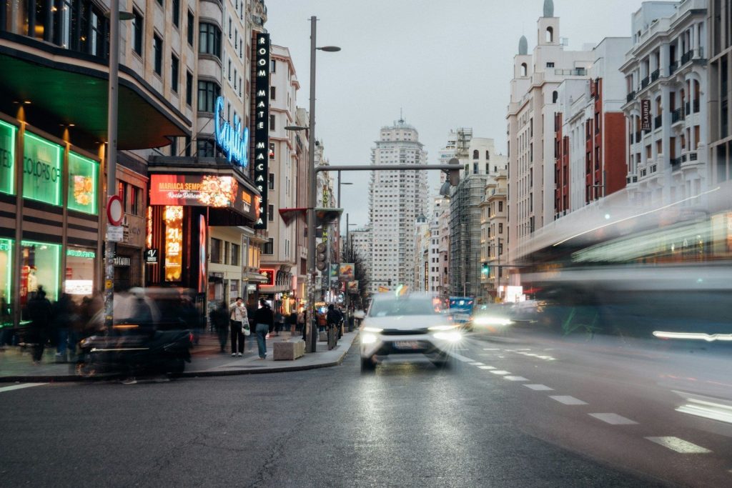 Blurred city street with cars and buildings at night