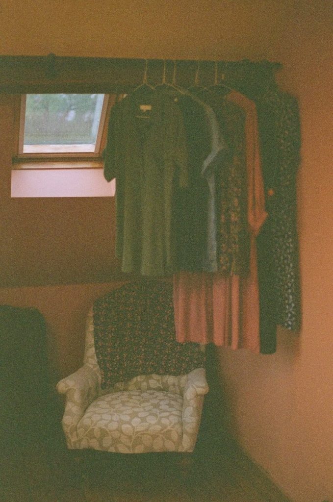 a chair sitting in front of a window in a room