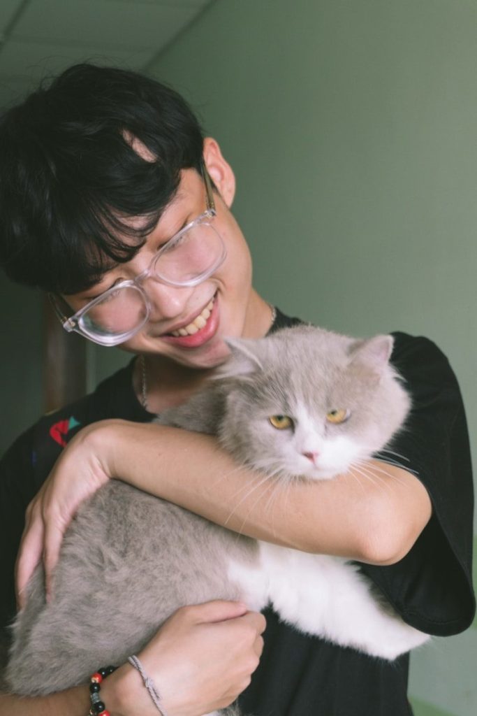 a person holding a cat