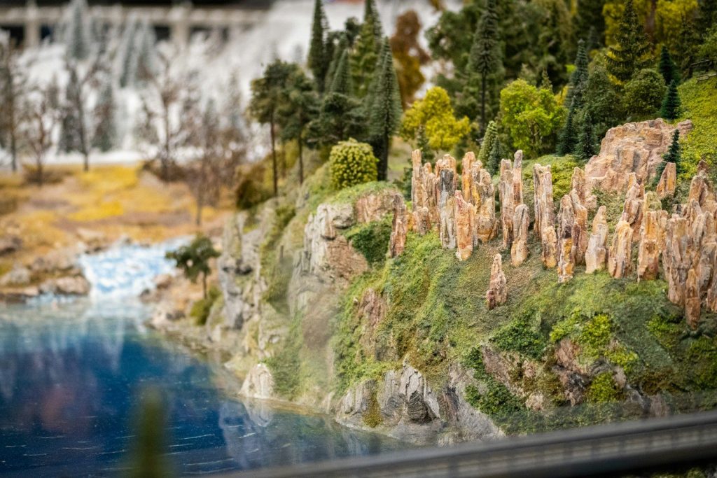 a model of a waterfall with trees and rocks